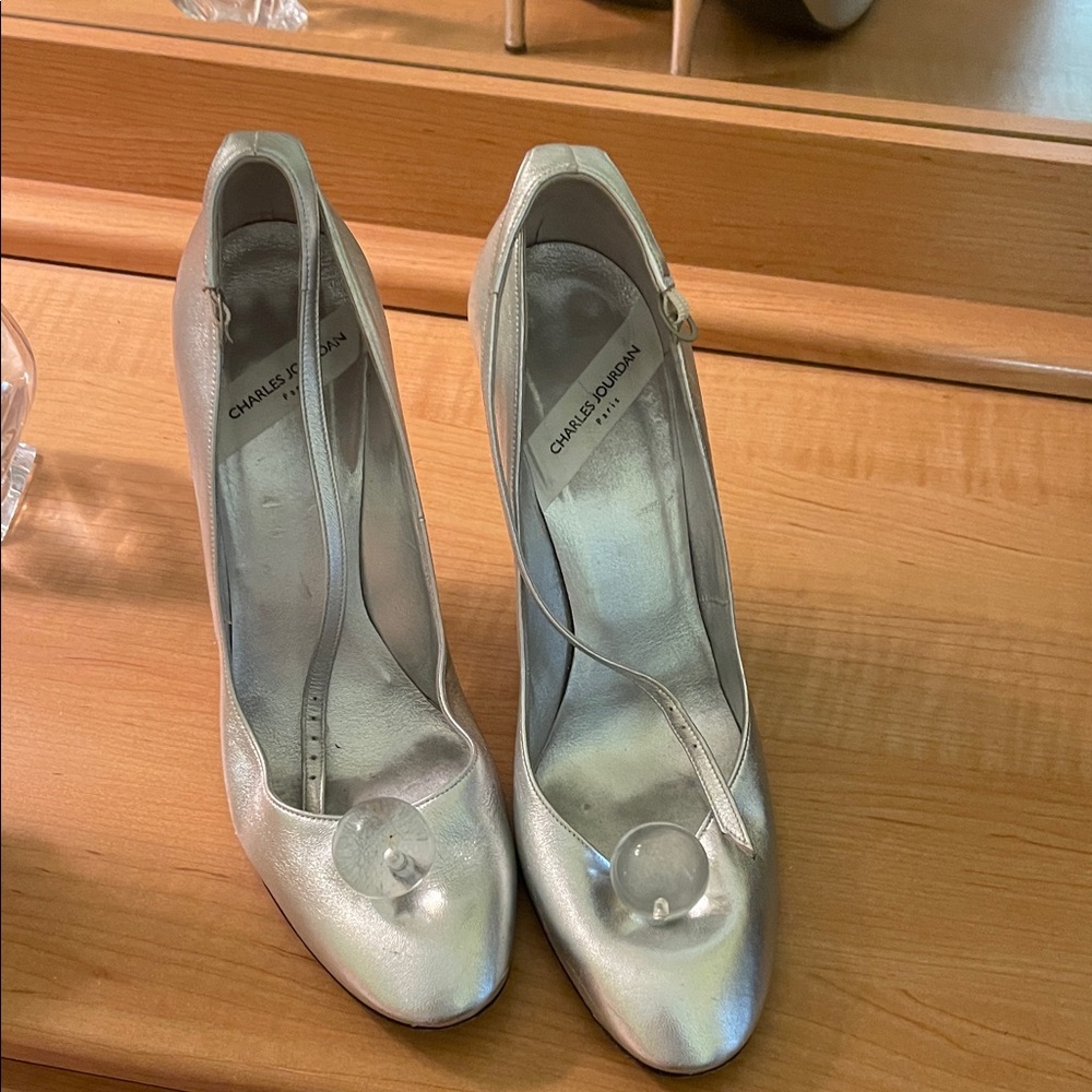 Charles Jourdan Silver Heels for Women in shimmering silver.